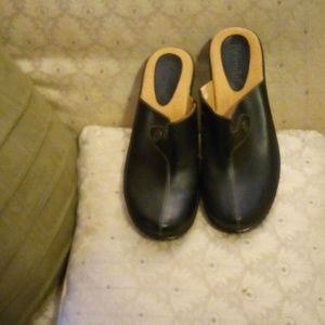 Black leather clogs